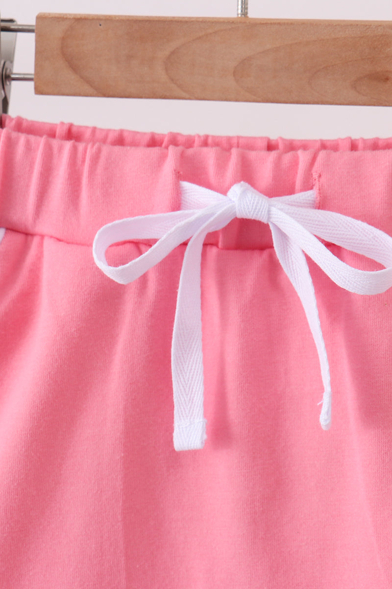 Deep pink scallop hem bow skort