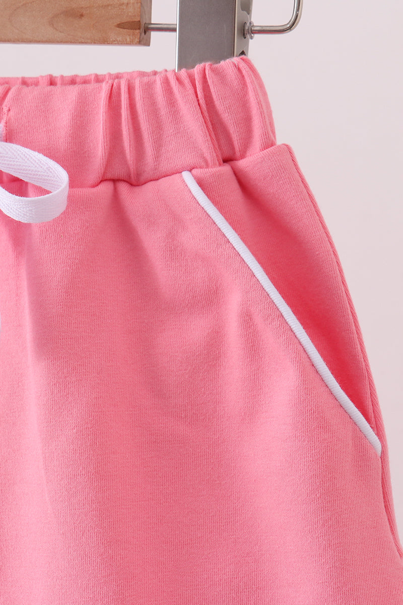Deep pink scallop hem bow skort